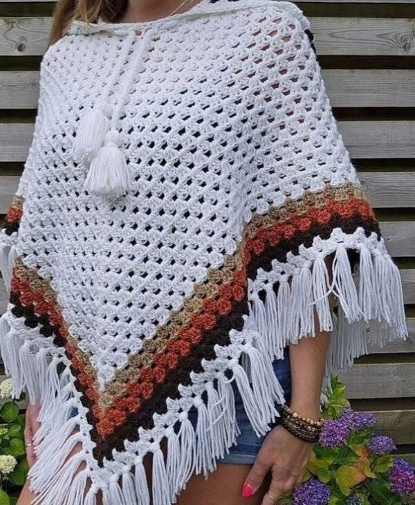 Crocheted cropped top with poncho-inspired fringe.